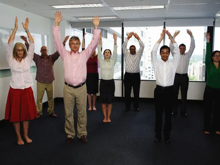 Group of employees participating in a brief office activity